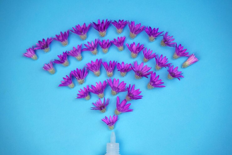 Foto las flores vuelan fuera de un tubo sobre un fondo azul