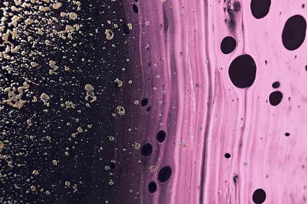 Flüssigkeitskunst Goldene metallische Partikel und rosa Wellen Marmor-Effekt Hintergrund oder Textur