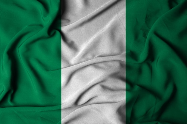 Foco seletivo da bandeira nigeriana, com textura de tecido acenando. ilustração 3D