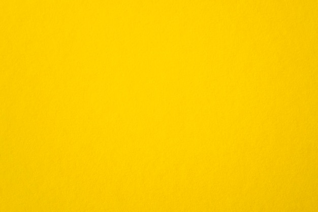 Folha amarela áspera de papel amarelo em branco como textura ou plano de fundo