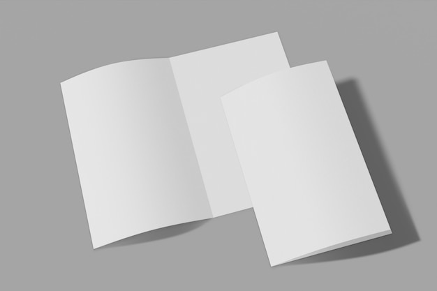 Foto folletos plegados sobre un fondo gris
