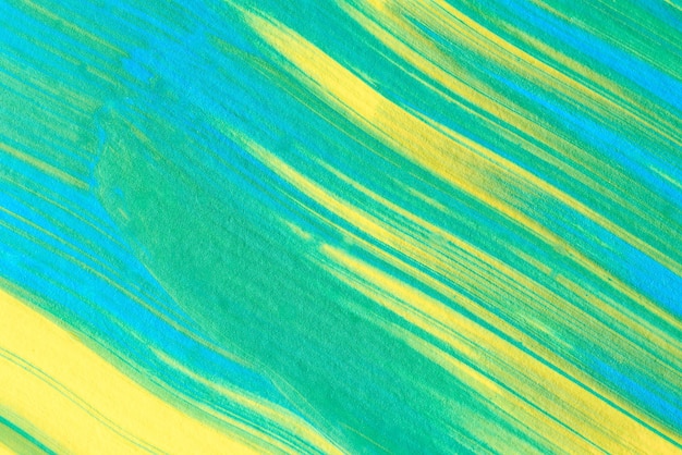 Fondo abstracto acrílico azul, verde y amarillo.