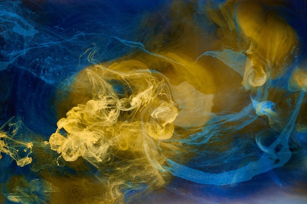 Fondo abstracto de arte fluido líquido Azul amarillo bailando pinturas acrílicas bajo el agua océano espacio humo