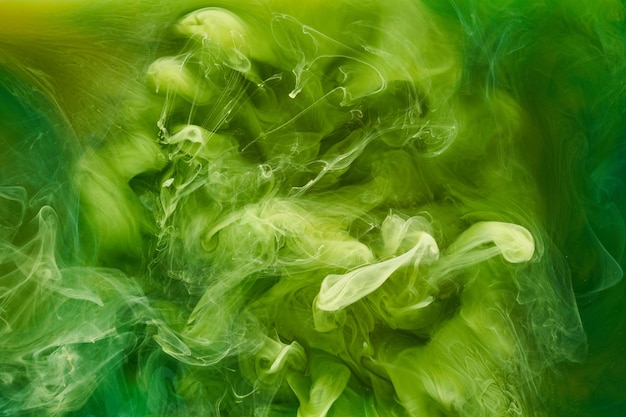 Fondo abstracto de arte fluido líquido Pinturas acrílicas de baile verde bajo el agua océano de humo cósmico