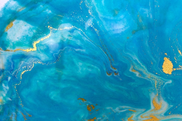 Fondo abstracto azul y oro veteado. Patrón de mármol líquido.