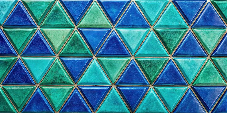 Foto fondo abstracto de azulejos triangulares coloridos de azul y verde gasolina