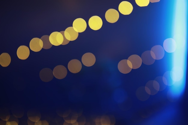 Fondo abstracto bokeh Círculos dorados bokeh sobre fondo azul oscuro Superposición de capa