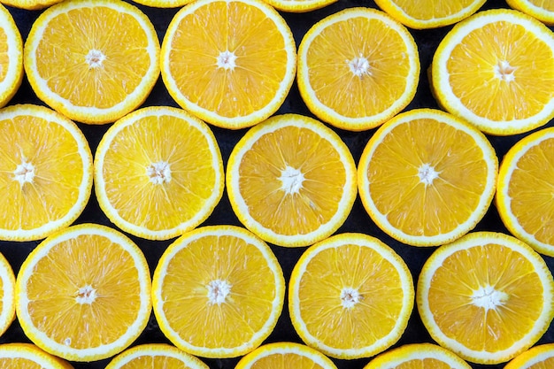 Fondo abstracto con cítricos de rodajas de naranja. De cerca.
