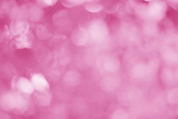 El fondo abstracto de color rosa claro con un hermoso efecto bokeh es perfecto para un fondo de día del amor