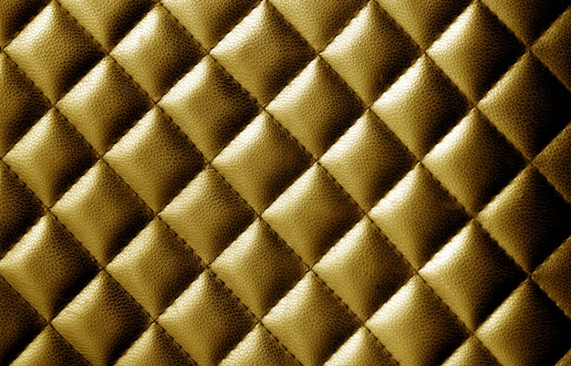 Fondo abstracto de cuero dorado con textura.