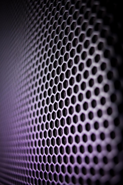 El fondo abstracto es una rejilla de metal negro para el primer plano del altavoz. Detalles del equipo de audio.