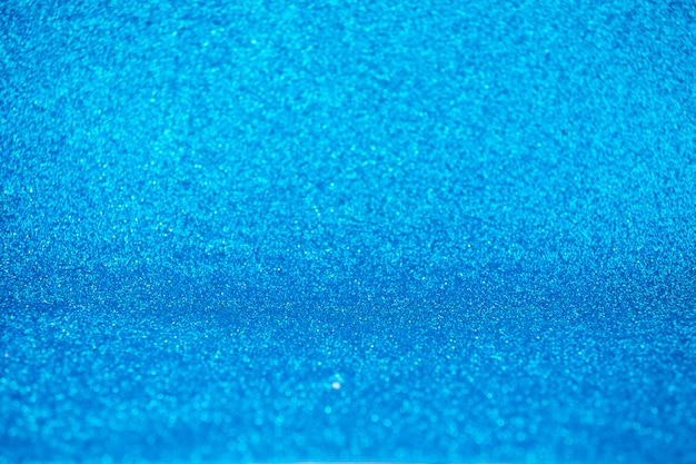 Fondo abstracto hermoso azul de brillo de luces navideñas