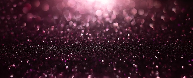 Fondo abstracto de luces purpurina rosa púrpura y oro con fondo desenfocado bokeh