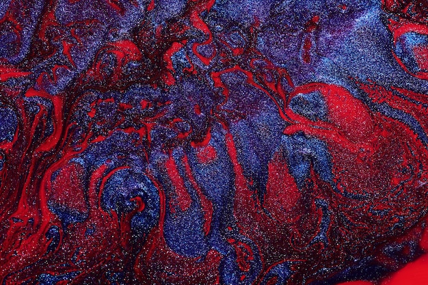 Fondo abstracto de lujo arte líquido Mezcla de tinta de alcohol azul rojo con manchas de pintura dorada Textura de mármol de la superficie del agua de la tierra