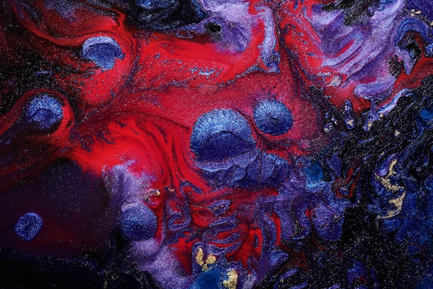 Fondo abstracto de lujo arte líquido Mezcla de tinta de alcohol azul rojo con manchas de pintura dorada Textura de mármol de la superficie del agua de la tierra