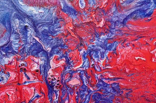 Fondo abstracto de lujo arte líquido Mezcla de tinta de alcohol azul rojo con manchas de pintura dorada Textura de mármol de la superficie del agua de la tierra