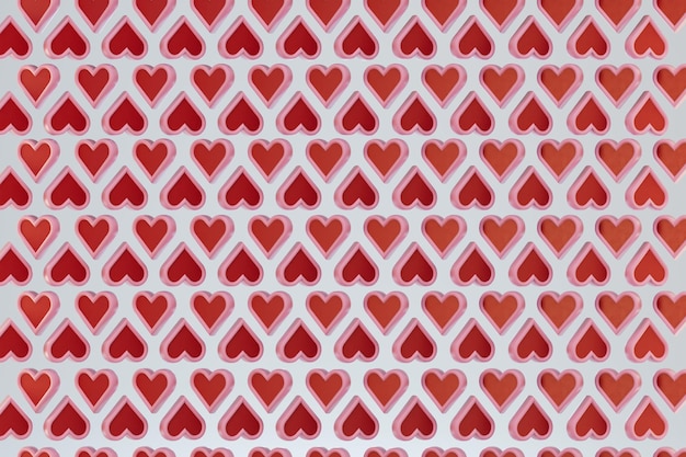 fondo abstracto. patrones de corazones rojos dispuestos en un patrón de tablero de ajedrez sobre un fondo blanco