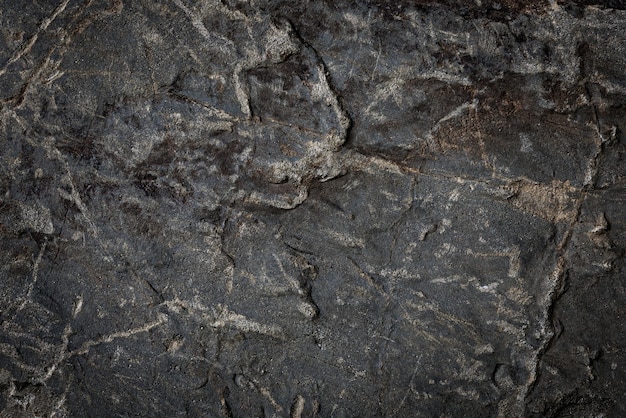 Fondo abstracto de piedra gris oscura natural o detalles altos de roca