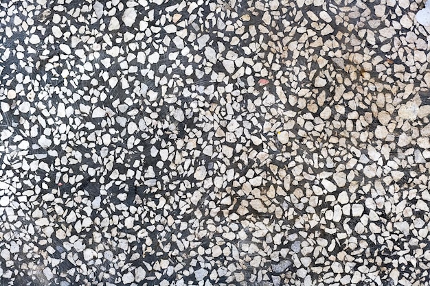 Fondo abstracto Piso de concreto gris con astillas de piedra blanca Superficie pulida suave