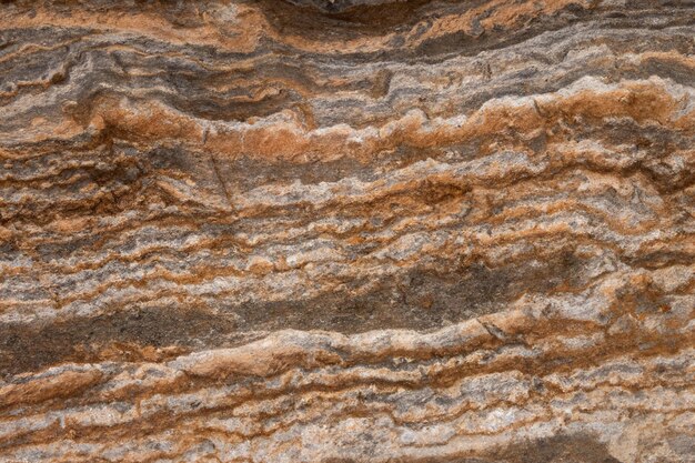 Fondo abstracto de roca de piedra de granito de textura gris y marrón