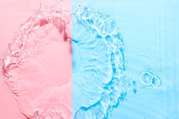 Fondo abstracto de superficie azul rosa agua Ondas y textura de ondulaciones de crema hidratante cosmética aqua con burbujas