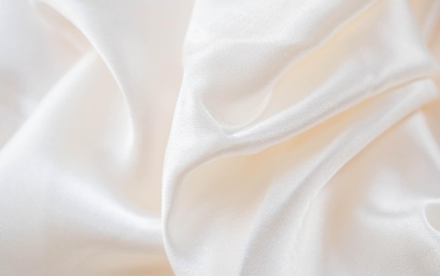Fondo abstracto de tela de lujo plegada textil o onda líquida o plegados ondulados textura de seda satén