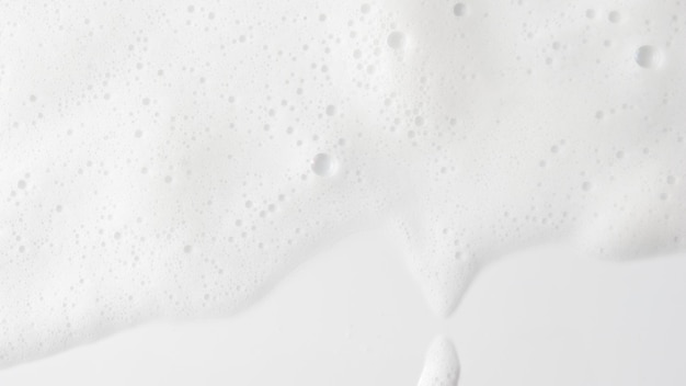 Fondo abstracto textura de espuma jabonosa blanca espuma de champú con burbujas