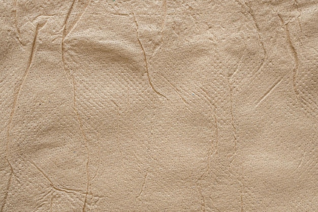 Fondo abstracto de textura de papel tisú reciclado marrón arrugado