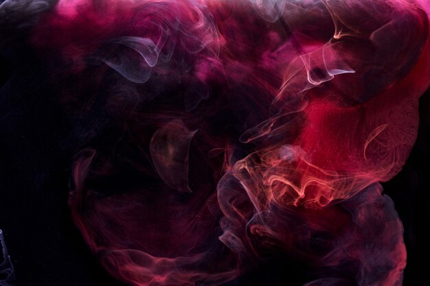 Fondo abstracto de tinta remolino de pigmento negro rojo, pintura de humo líquido bajo el agua