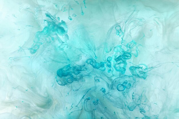 Fondo abstracto de tinta verde esmeralda Fondo de pintura acrílica para perfume hookah cosméticos Misteriosas nubes de humo niebla colorida