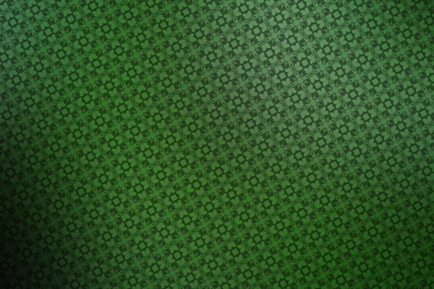 Fondo abstracto verde con un patrón de trébol de cuatro hojas