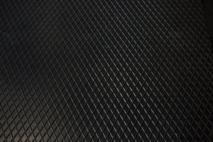 Foto fondo de acero de textura de metal negro chapa perforada