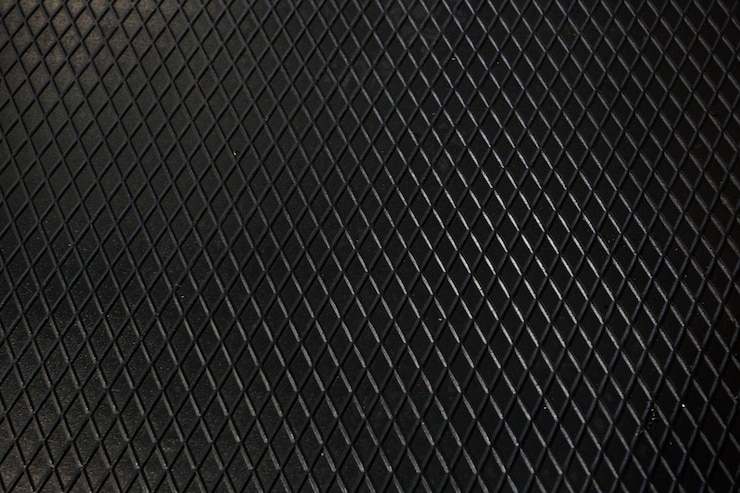 Foto fondo de acero de textura de metal negro chapa perforada