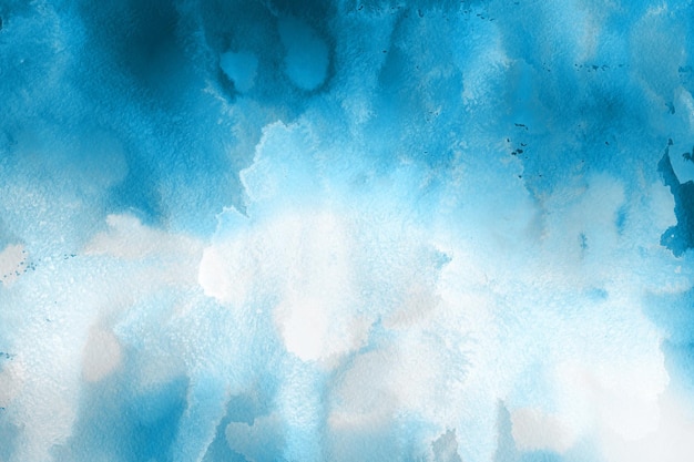 Fondo de acuarela azul invierno helado pintado sobre papel blanco