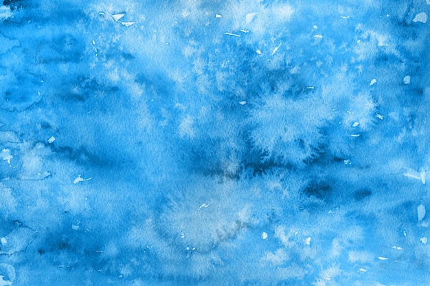 Fondo de acuarela azul invierno helado pintado sobre papel blanco