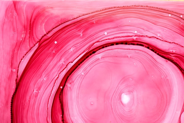 Fondo de acuarela rosa abstracta. Manchas de pintura y manchas onduladas en el agua, papel tapiz de arte líquido fluido de lujo