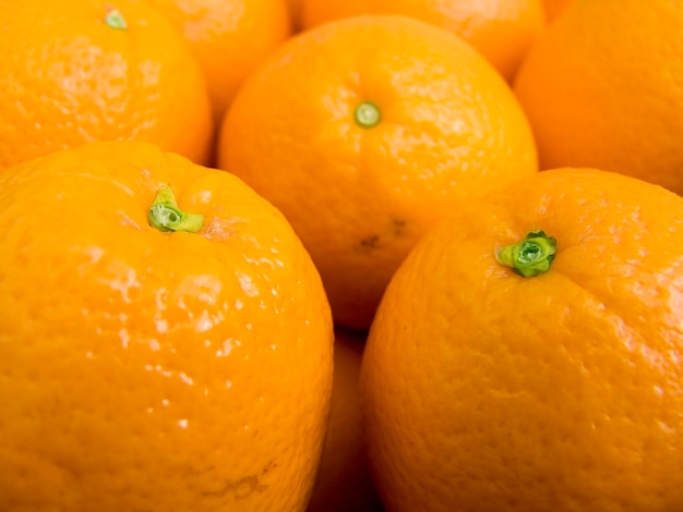 Foto fondo agrícola una pila de hermosas naranjas