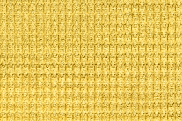 Foto fondo amarillo brillante de suave tejido lanoso de cerca, textura de macro de textiles