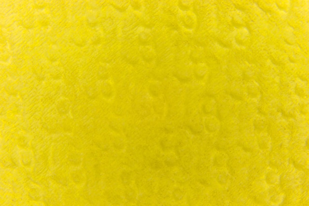 Fondo amarillo de una servilleta de papel en relieve