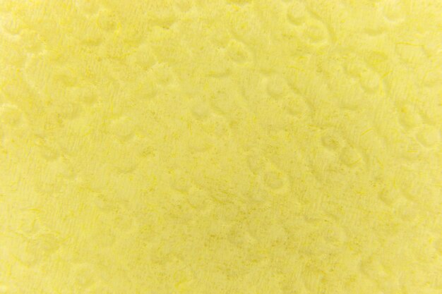 Fondo amarillo de una servilleta de papel en relieve