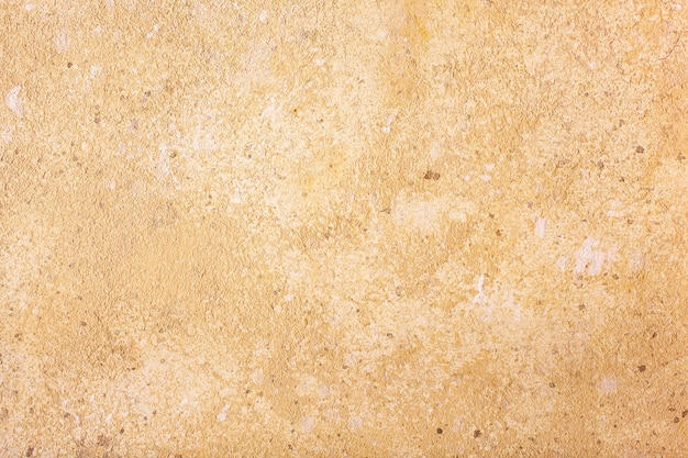 Fondo amarillo de la textura del muro de cemento.