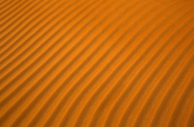 Foto fondo de arena del desierto naranja con líneas