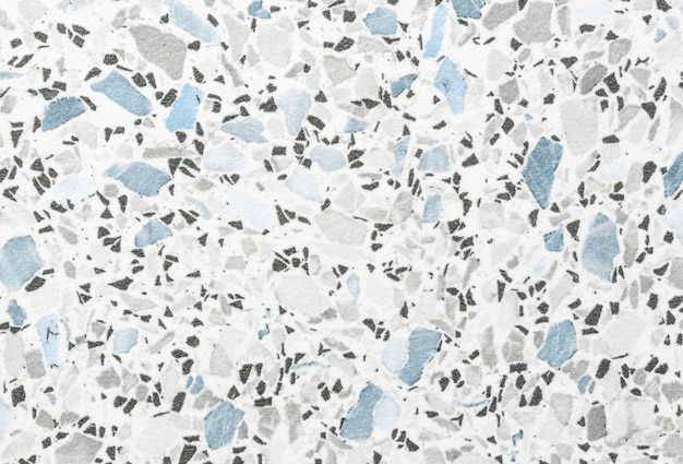 Foto fondo de arte abstracto blanco. pintura de acuarela sobre lienzo con manchas negras y azules. piso de mosaico de pequeño patrón de guijarros grises. telón de fondo de textura de la mesa.