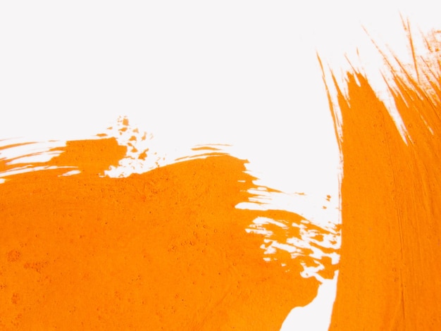 Foto fondo de arte acuarela creativa. patrón de salpicaduras de colores naranja, fondo de papel blanco