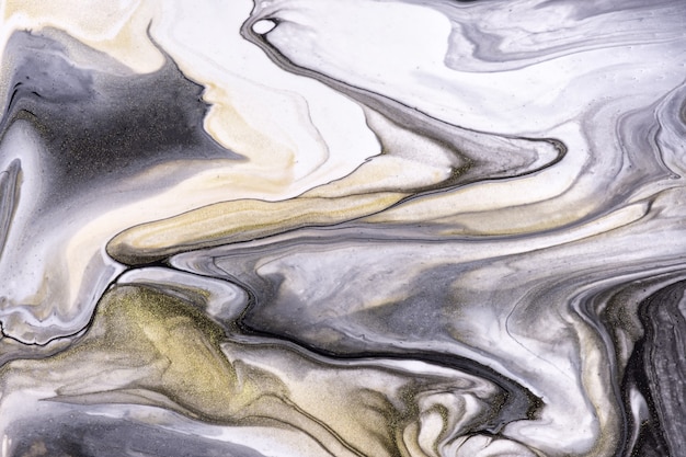 Fondo de arte fluido abstracto colores blanco y negro. Mármol líquido. Cuadro acrílico sobre lienzo con degradado dorado. Telón de fondo de tinta con patrón gris.