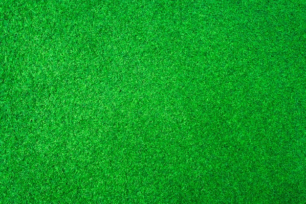 Foto fondo artificial de la textura de la hierba verde o del campo de deporte.