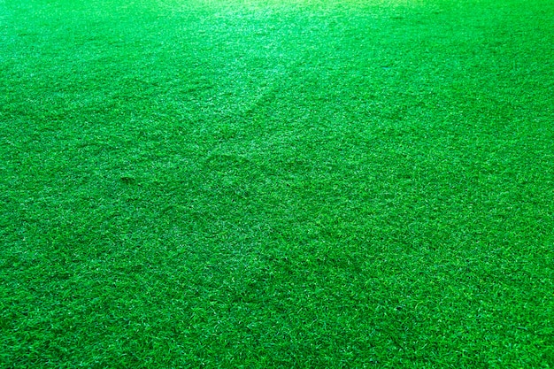 Foto fondo artificial de la textura de la hierba verde o del campo de deporte.