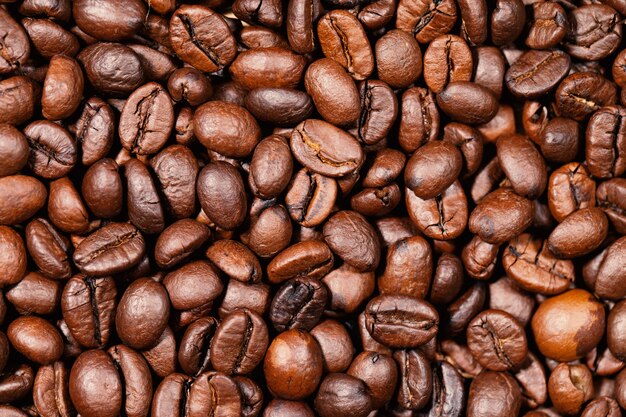 Fondo asado de la textura de los granos de café, primer