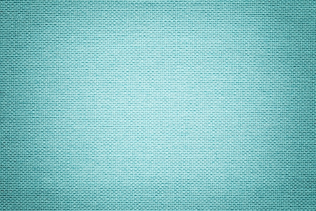 Fondo azul claro de un material textil. Tejido con textura natural.