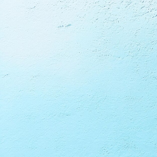 Foto fondo azul claro con textura áspera en la pared